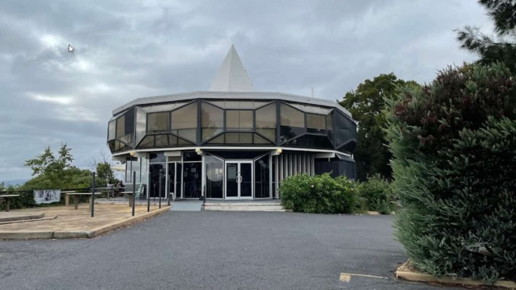 Expert Roof Repairs Canberra team restoring unique hexagonal roof in Deakin